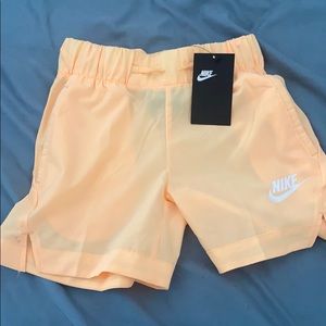 Nike shorts NWT. ORANGE